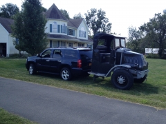 Welded a trailer hitch on, can pull it around.   Dwarfs the Tahoe.