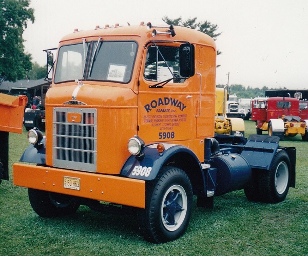 This Mack H633 in the orange and blue Roadway colors was on display at Macu...