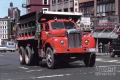 mack-dump-truck-driving-in-new-york-city-wernher-krutein.jpg